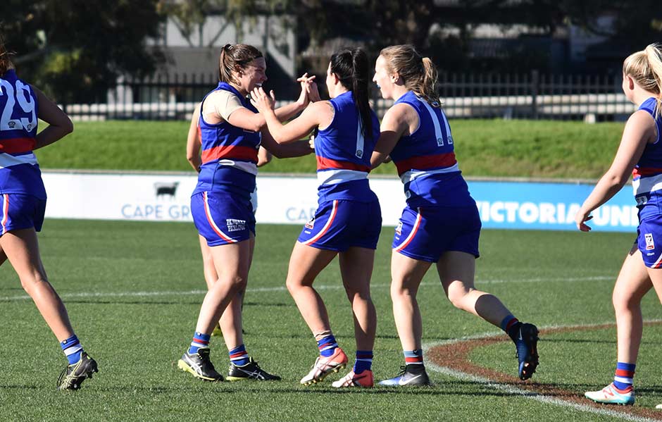 HERO_VFLW_DSC_0611.jpg Kirtsy Lamb and Brooke Lochland, celebrate Hayley Wildes' (right) fourth quarter goal at VU Whitten Oval. Photo: Brooke Muscat - AFLW,Western Bulldogs